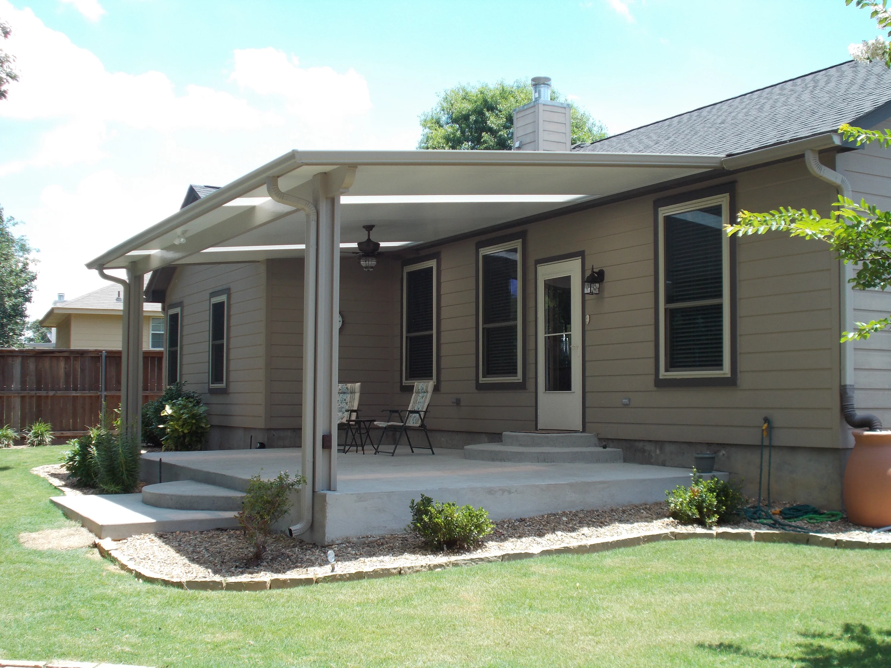 Simple beige flat-panel cover attached to a residential home