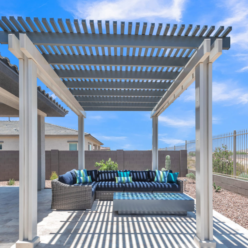 Wide-angle lattice cover over an outdoor lounge with sectional seating