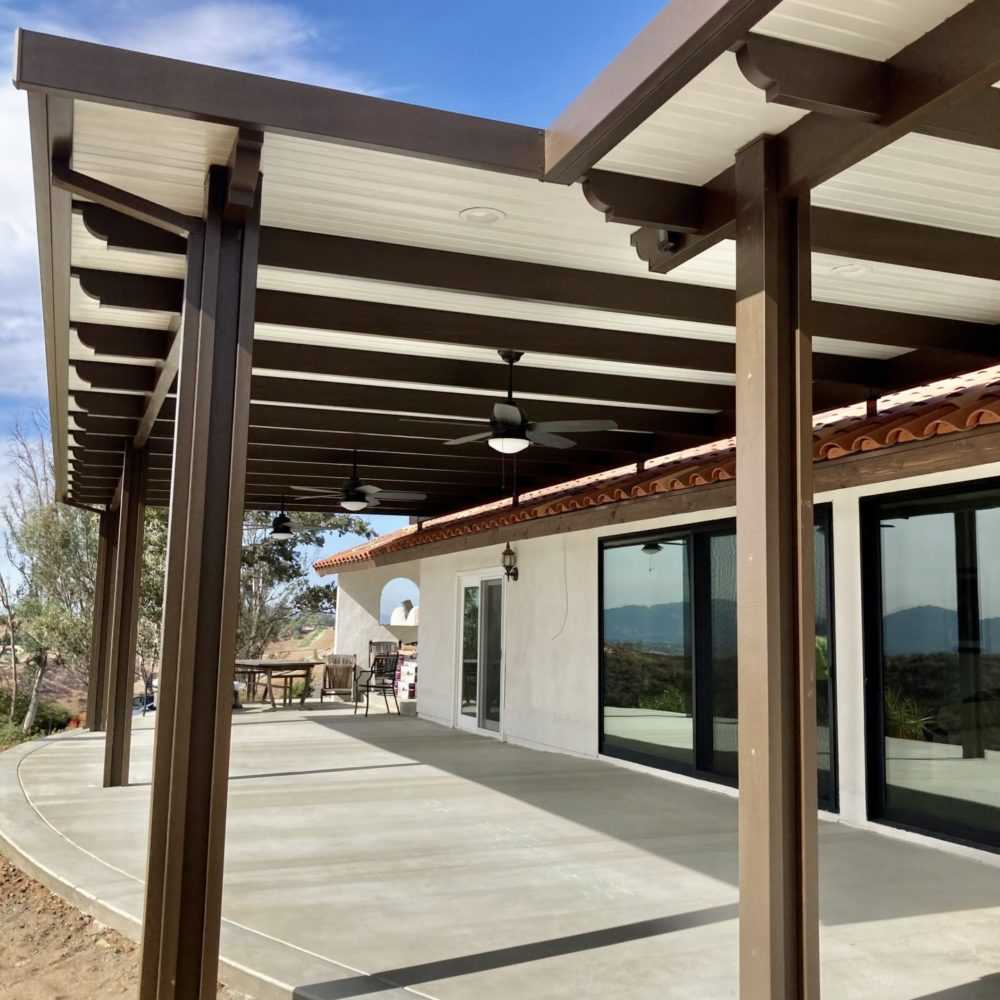 Mediterranean home with combo patio cover and hill view